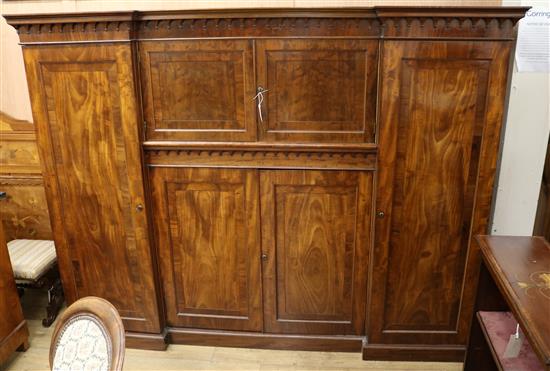 A Victorian mahogany inverted breakfront wardrobe W.218cm